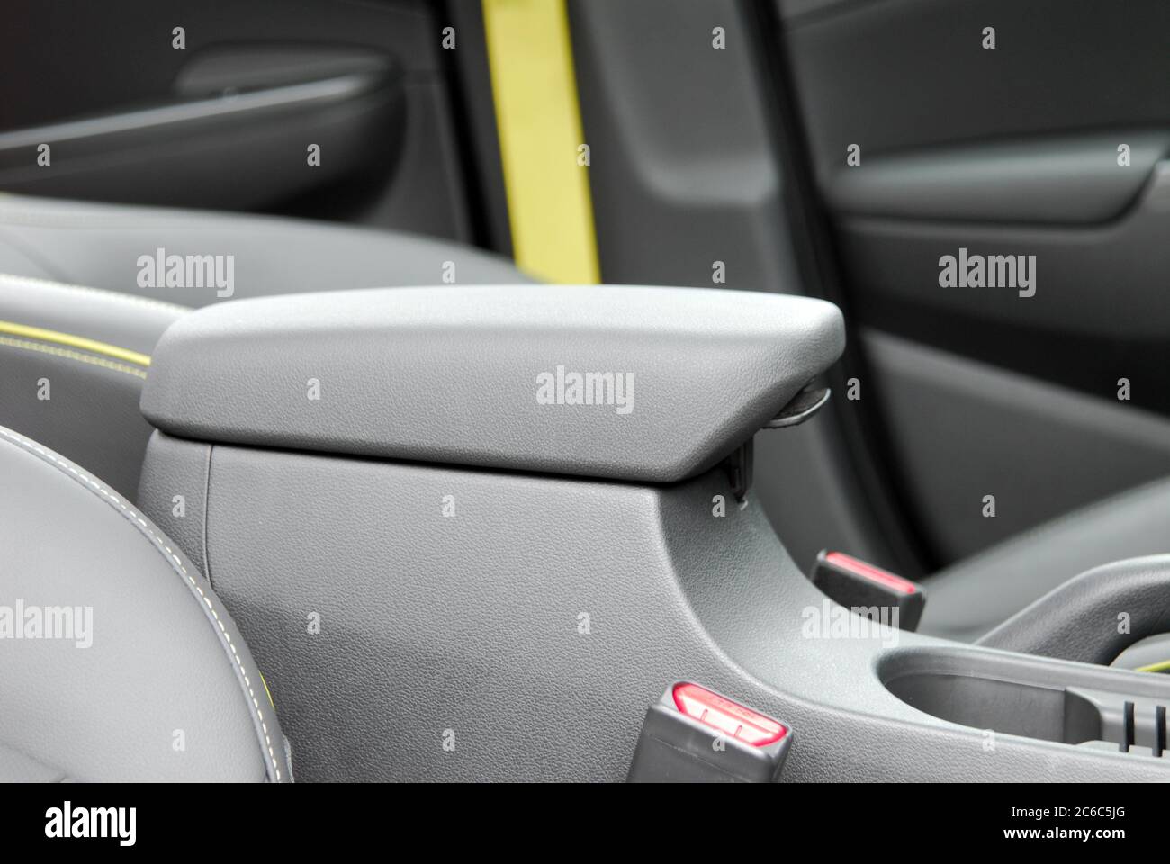 Armrest in the luxury passenger car between front seats. Stock Photo