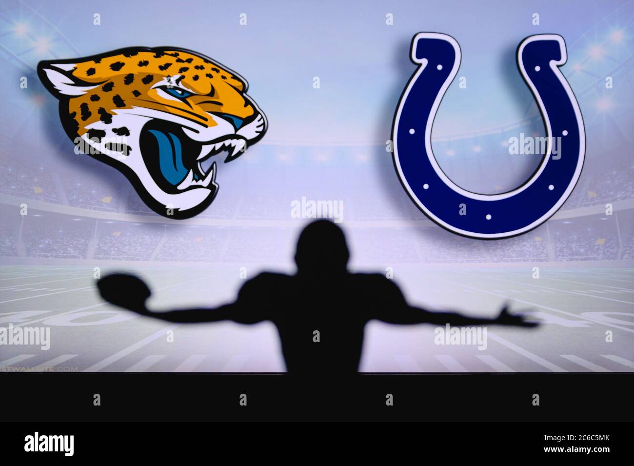Jacksonville Jaguars vs. Indianapolis Colts. NFL Game. American Football League match. Silhouette of professional player celebrate touch down. Screen Stock Photo
