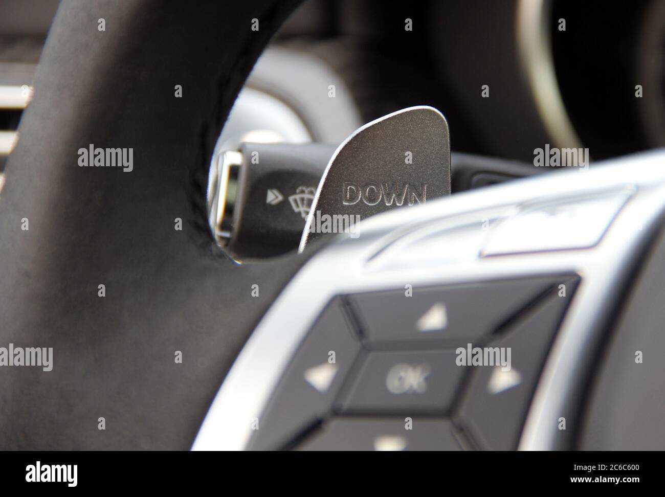 https://c8.alamy.com/comp/2C6C600/shift-paddles-steering-wheel-with-shift-paddles-manual-gear-changing-stick-on-a-cars-steering-wheel-2C6C600.jpg