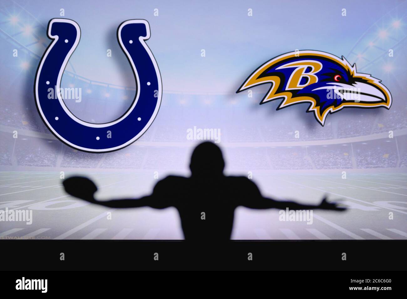 Indianapolis Colts vs. Baltimore Ravens. NFL Game. American Football League match. Silhouette of professional player celebrate touch down. Screen in b Stock Photo