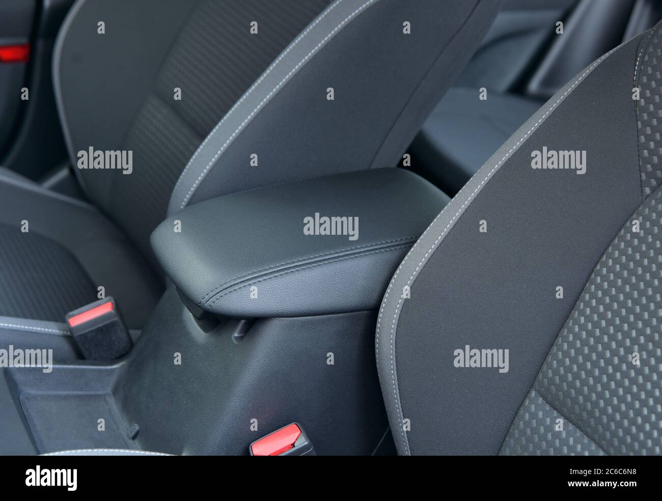 Armrest in the luxury passenger car between front seats. Stock Photo