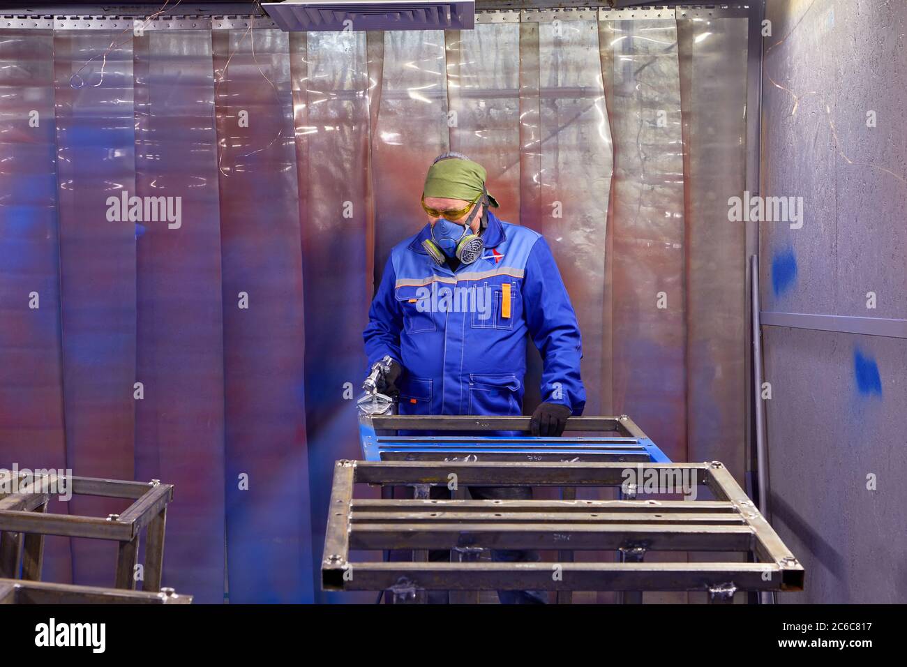 St. Petersburg, Russia - December 24, 2018: The worker uses a respirator to protect the respiratory system, as well as safety glasses to protected the Stock Photo