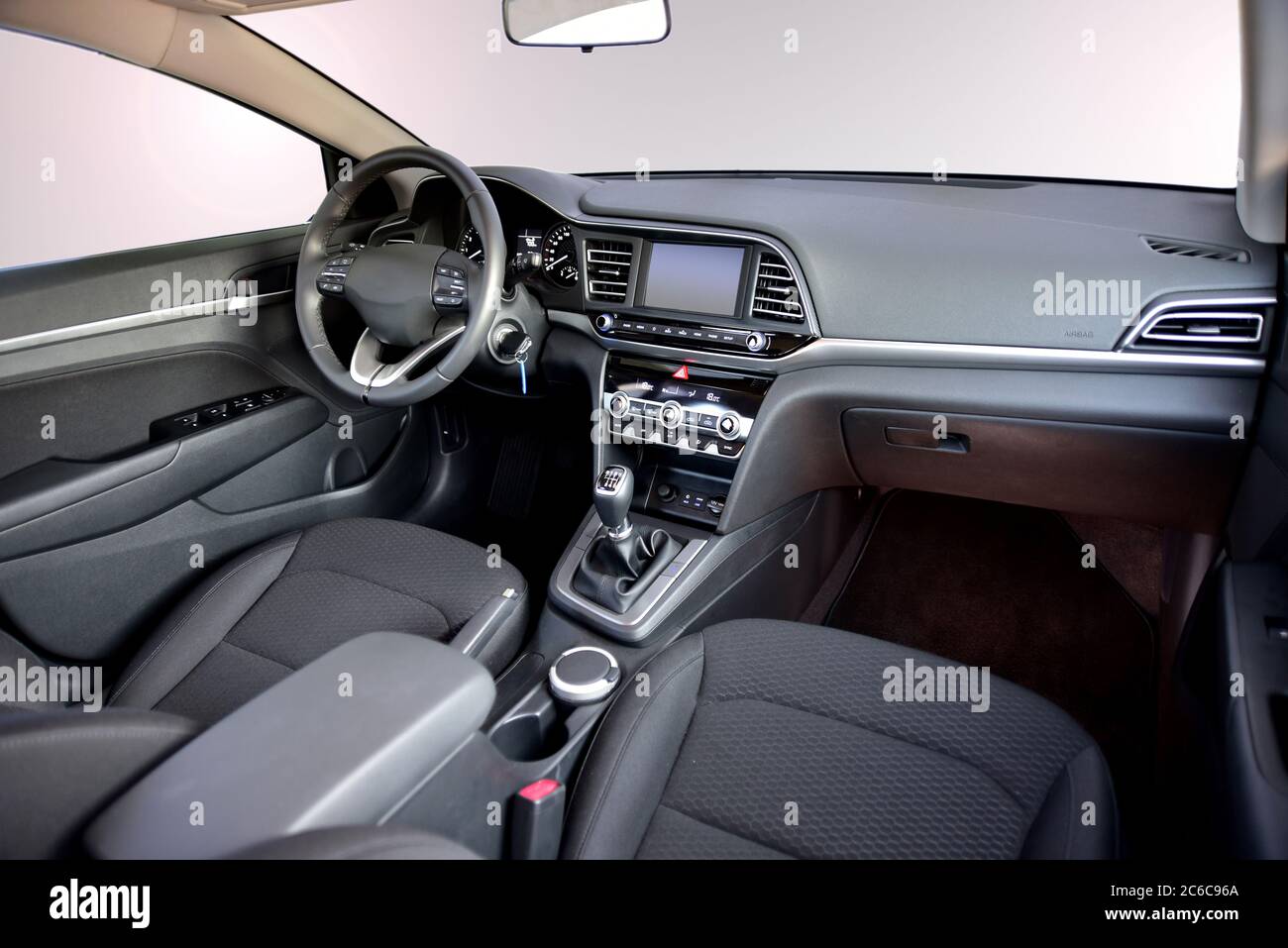 Car interior. The inside of the car, front view. Dashboard of a modern car. Stock Photo