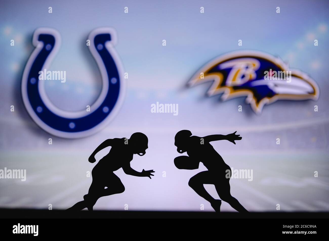 Indianapolis Colts vs. Baltimore Ravens. NFL match poster. Two american football players silhouette facing each other on the field. Clubs logo in back Stock Photo