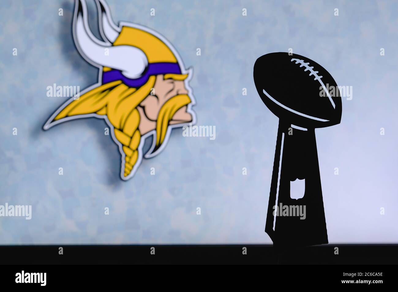Minnesota Vikings professional american football club, silhouette of NFL  trophy, logo of the club in background Stock Photo - Alamy