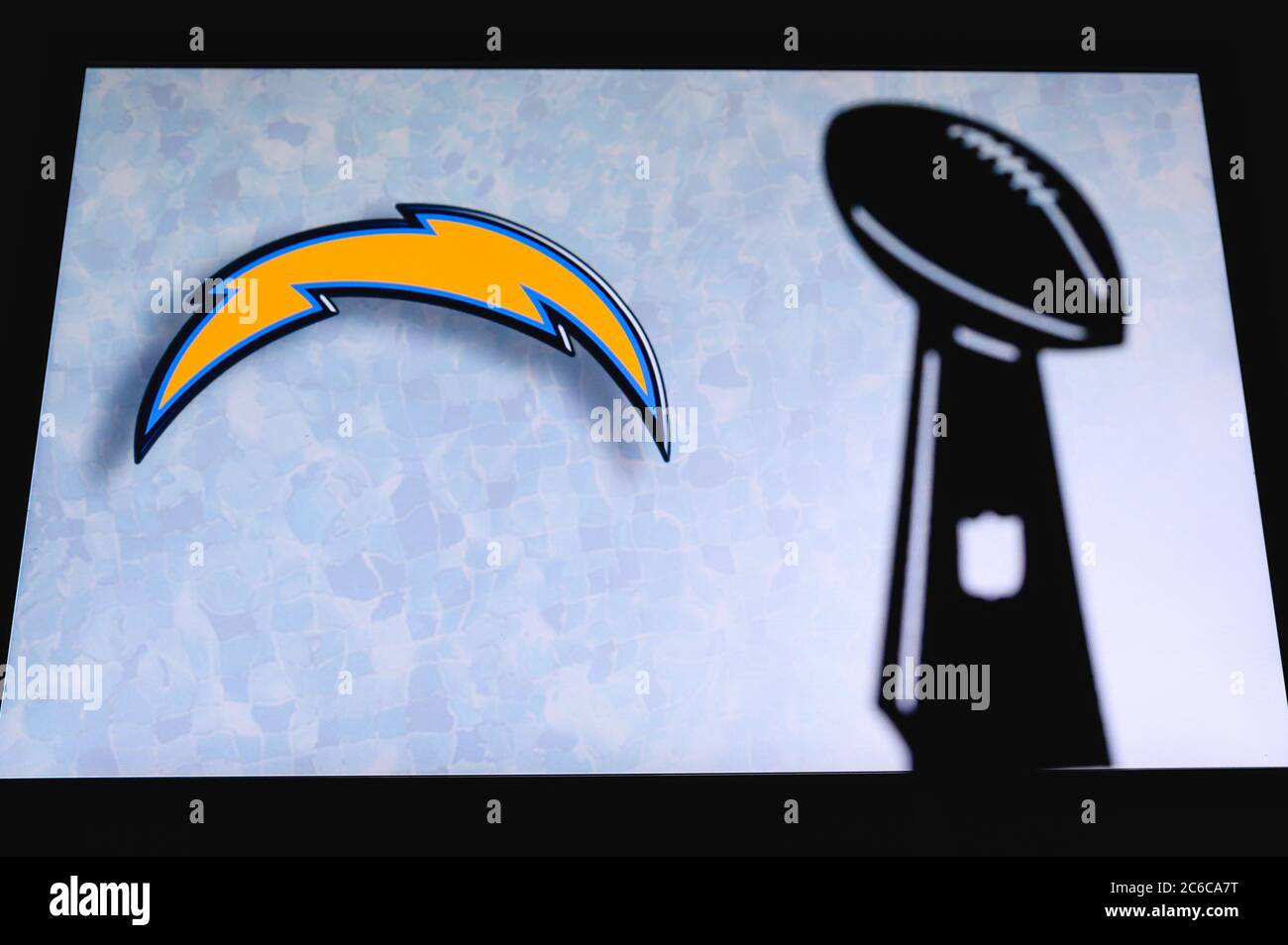 Los Angeles Chargers professional american football club, silhouette of NFL  trophy, logo of the club in background Stock Photo - Alamy