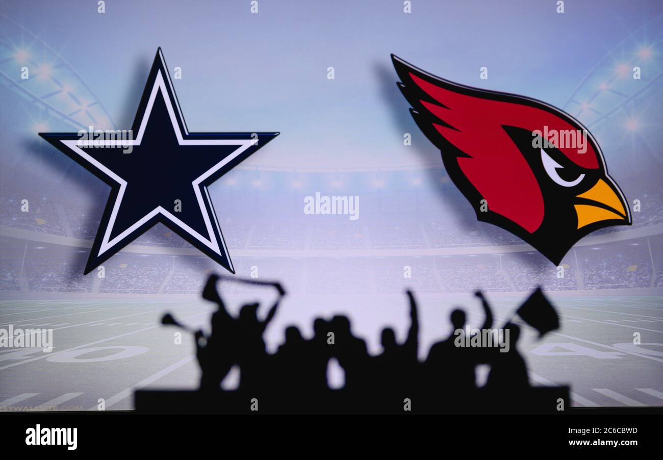 Dallas Cowboys vs. Arizona Cardinals . Fans support on NFL Game. Silhouette of supporters, big screen with two rivals in background. Stock Photo