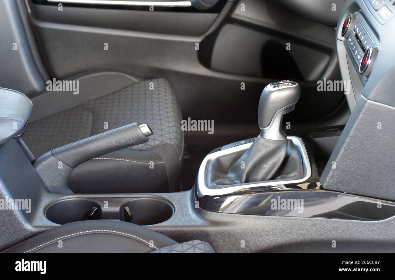 Manual gear shift and handbrake inside the passenger car Stock Photo