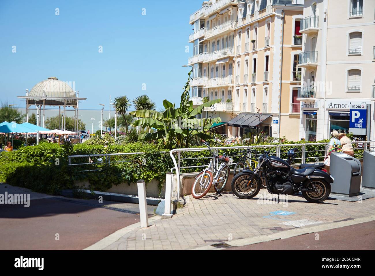 Biarritz, France - June 17, 2018: Rue Mazagran. Bicycle and motorcycle parked on the street Stock Photo