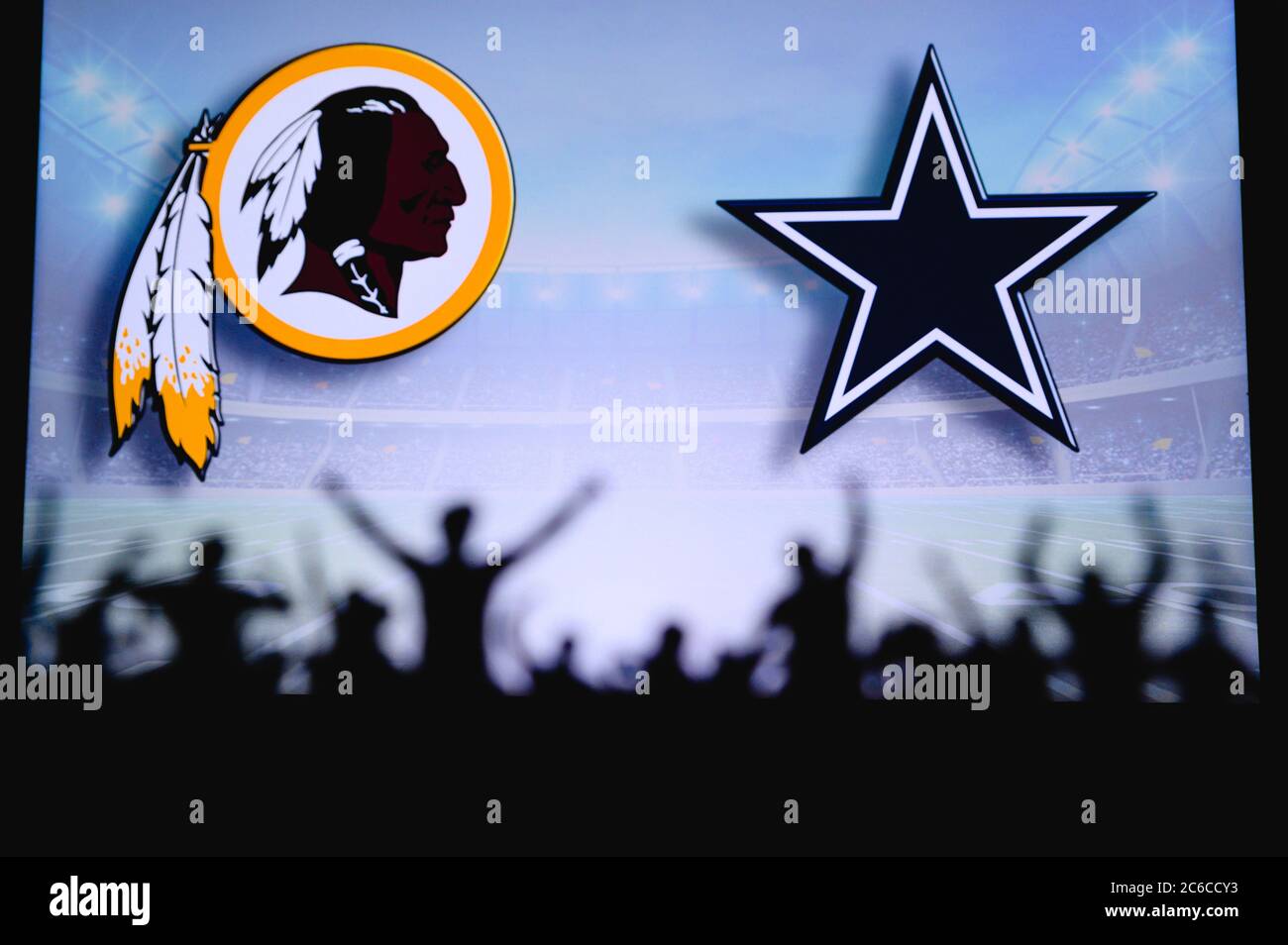 Washington Redskins vs. Dallas Cowboys. Fans support on NFL Game.  Silhouette of supporters, big screen with two rivals in background Stock  Photo - Alamy