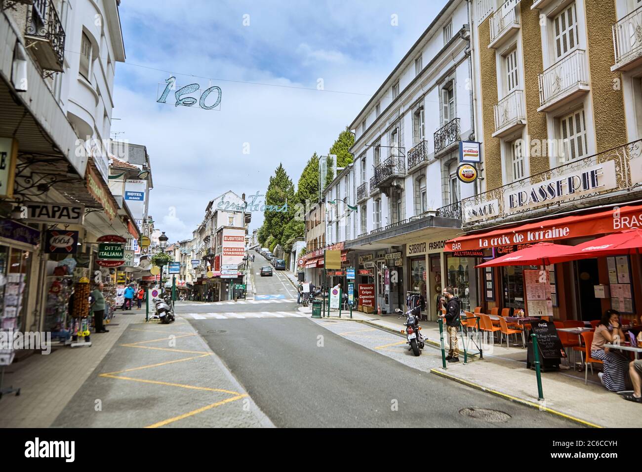 Lourdes, France - June 18, 2018: Boulevard de la Grotte. Buildings with  showcases of cafes and shops Stock Photo - Alamy