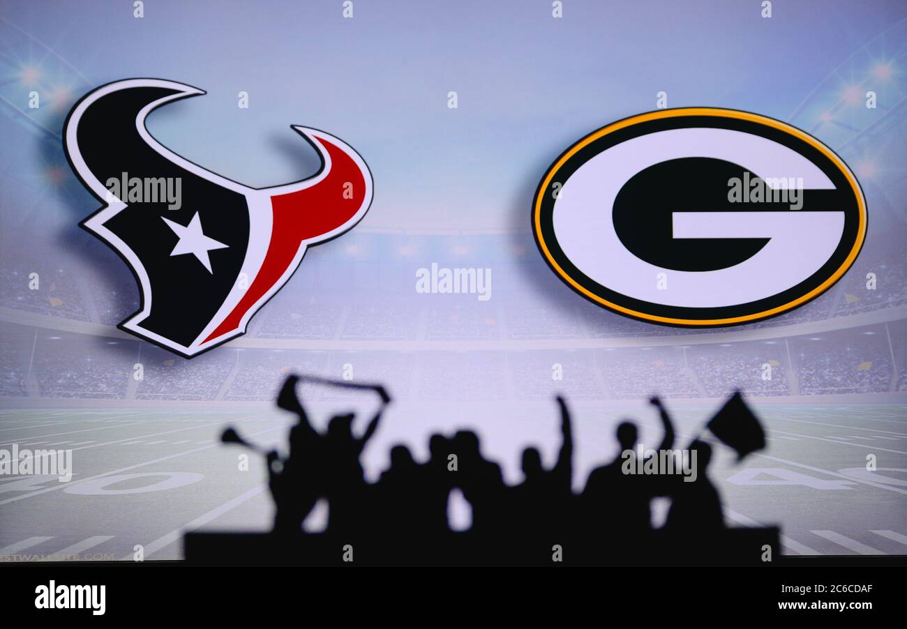 Houston Texans vs. Green Bay Packers. Fans support on NFL Game. Silhouette of supporters, big screen with two rivals in background. Stock Photo