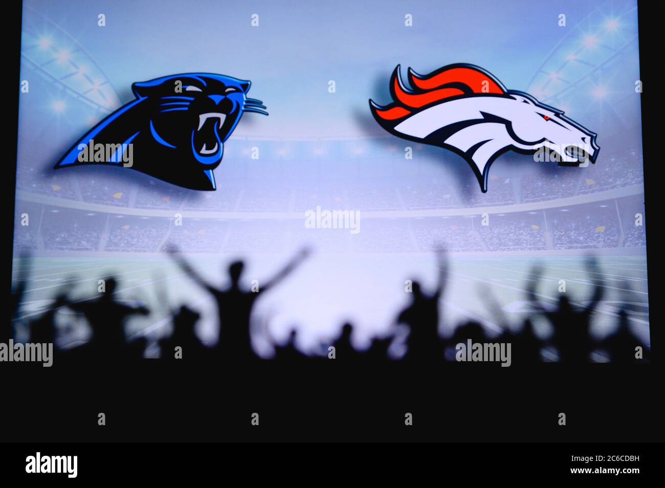 Carolina Panthers vs. Denver Broncos. Fans support on NFL Game. Silhouette  of supporters, big screen with two rivals in background Stock Photo - Alamy