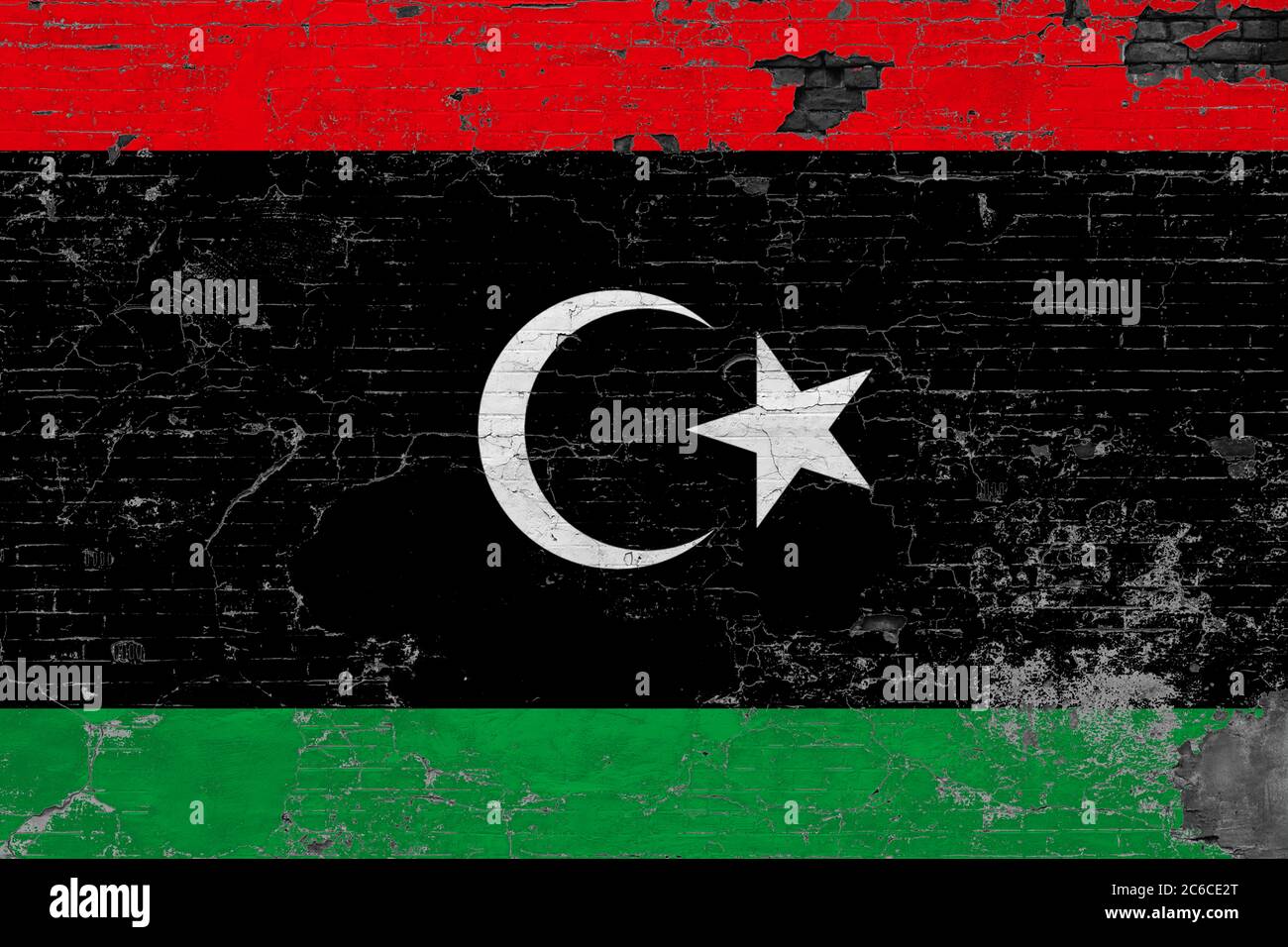 Libya flag on grunge scratched concrete surface. National vintage ...