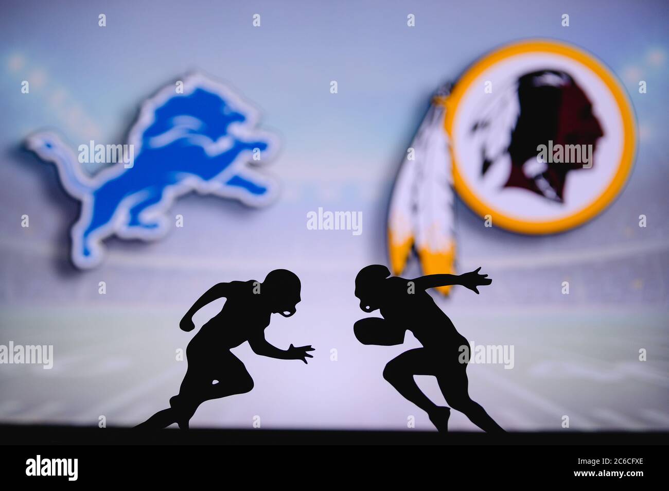 Detroit Lions vs. Washington Redskins. NFL match poster. Two american football players silhouette facing each other on the field. Clubs logo in backgr Stock Photo