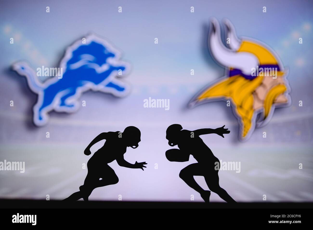 Detroit Lions vs.Minnesota Vikings . NFL match poster. Two american football players silhouette facing each other on the field. Clubs logo in backgrou Stock Photo
