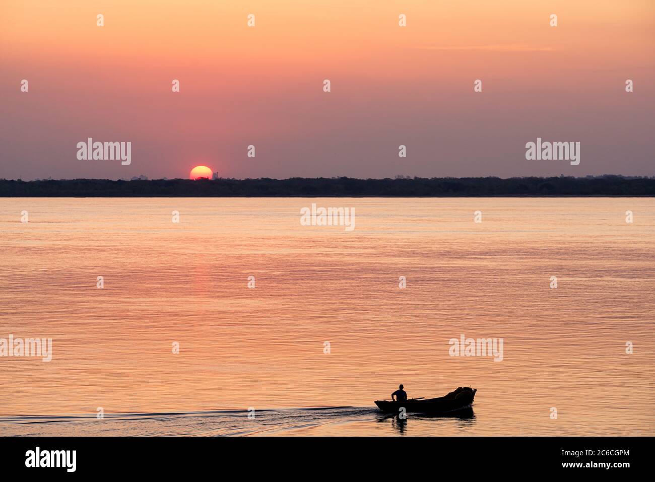 Silhouette of a fisherman watching the sunset Stock Photo - Alamy