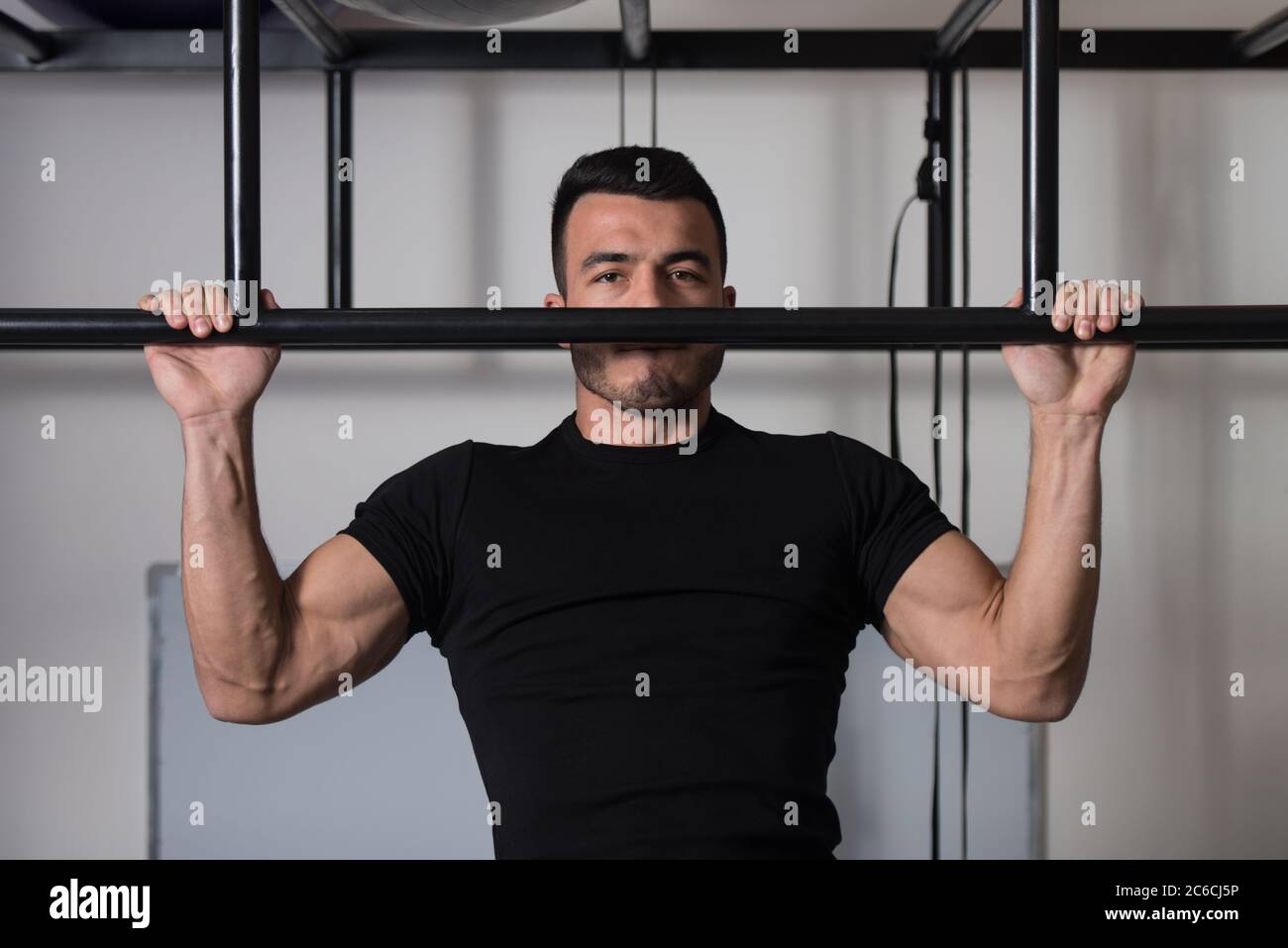 Handsome Bodybuilder Doing Heavy Weight Exercise for Back Typewriter Pull  Ups Stock Photo - Alamy