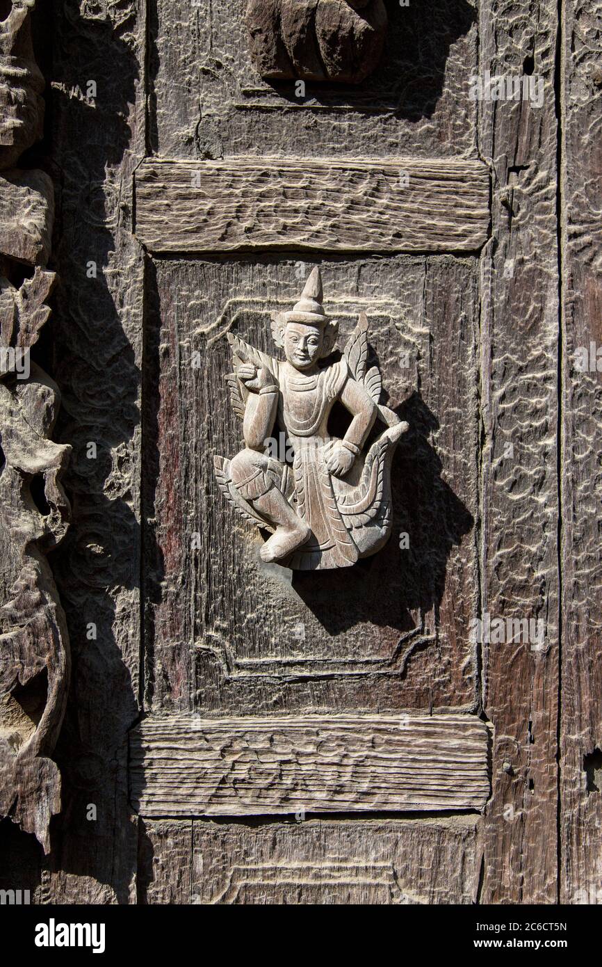 A close-up detail of wood carvings on the exterior of an ancient Temple in Bagan, Myanmar Stock Photo