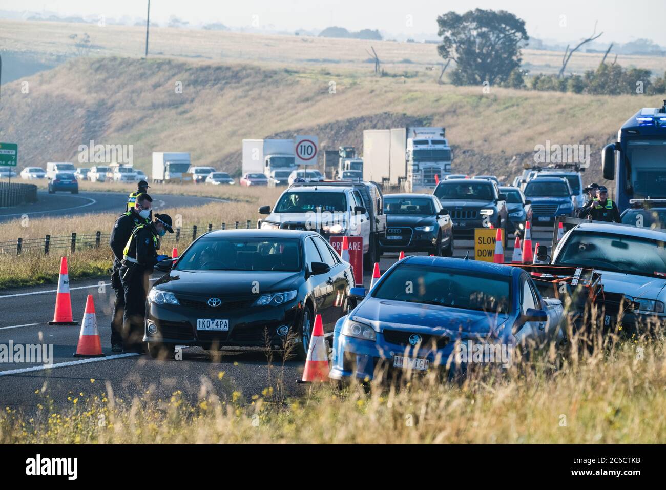 Melbourne, Australia 9 July 2020. Victoria Police road blocks are now checking cars leaving the city along highways. A checkpoint on the Western Highway between Melton and Bacchus Marsh was in operation this morning checking cars travelling towards Ballarat. Credit: Michael Currie/Alamy Live News Stock Photo