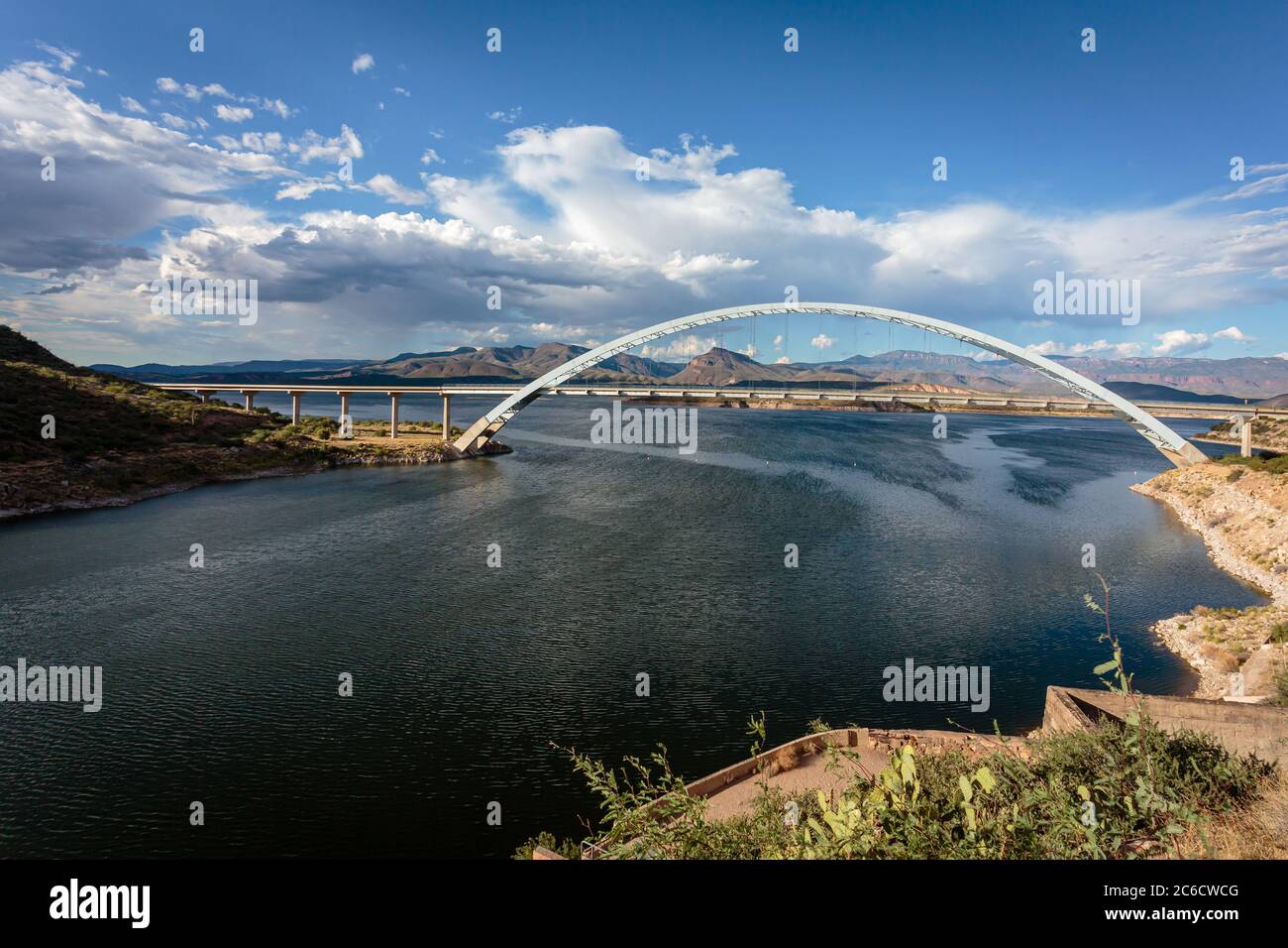 Roosevelt Lake Bridge frames the distant desert mountains. Near Globe, Arizona. Stock Photo