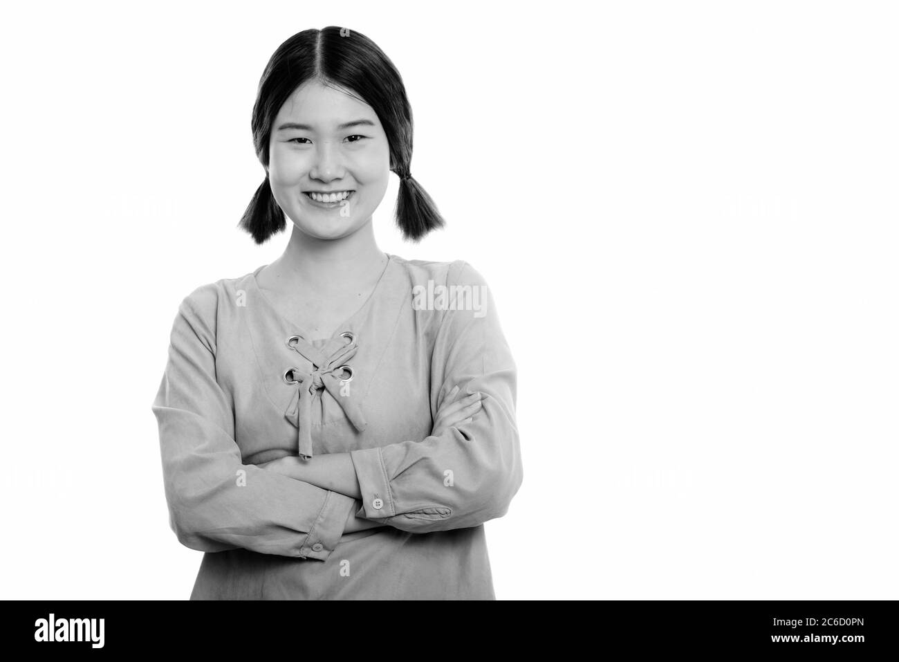 Studio shot of young happy Asian woman smiling with arms crossed Stock ...