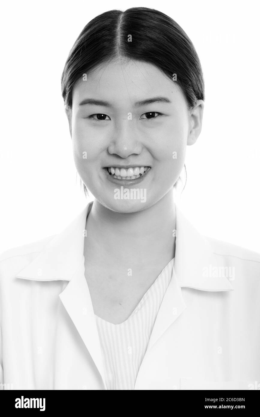 Face of young happy Asian woman doctor smiling Stock Photo - Alamy