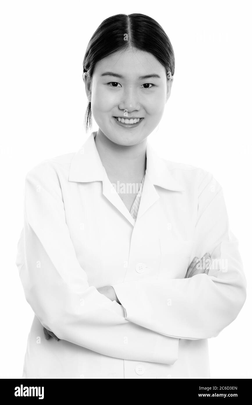 Young happy Asian woman doctor smiling with arms crossed Stock Photo ...