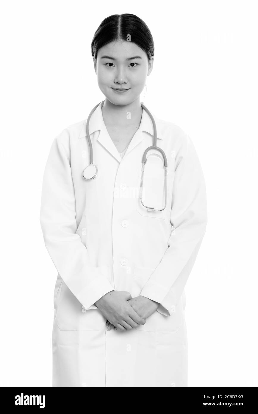 Studio shot of young beautiful Asian woman doctor standing Stock Photo ...