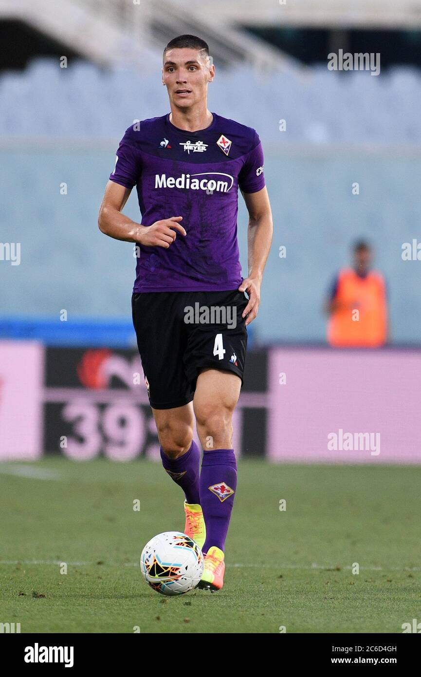 Florence, Italy. 21st May, 2022. Moise Kean of Juventus FC and Nikola  Milenkovic of ACF Fiorentina compete for the ball during the Serie A  2021/2022 football match between ACF Fiorentina and Juventus