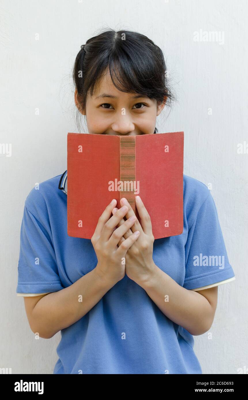 Asian Teenager Girl Happy After Reading a Book Stock Photo Alamy