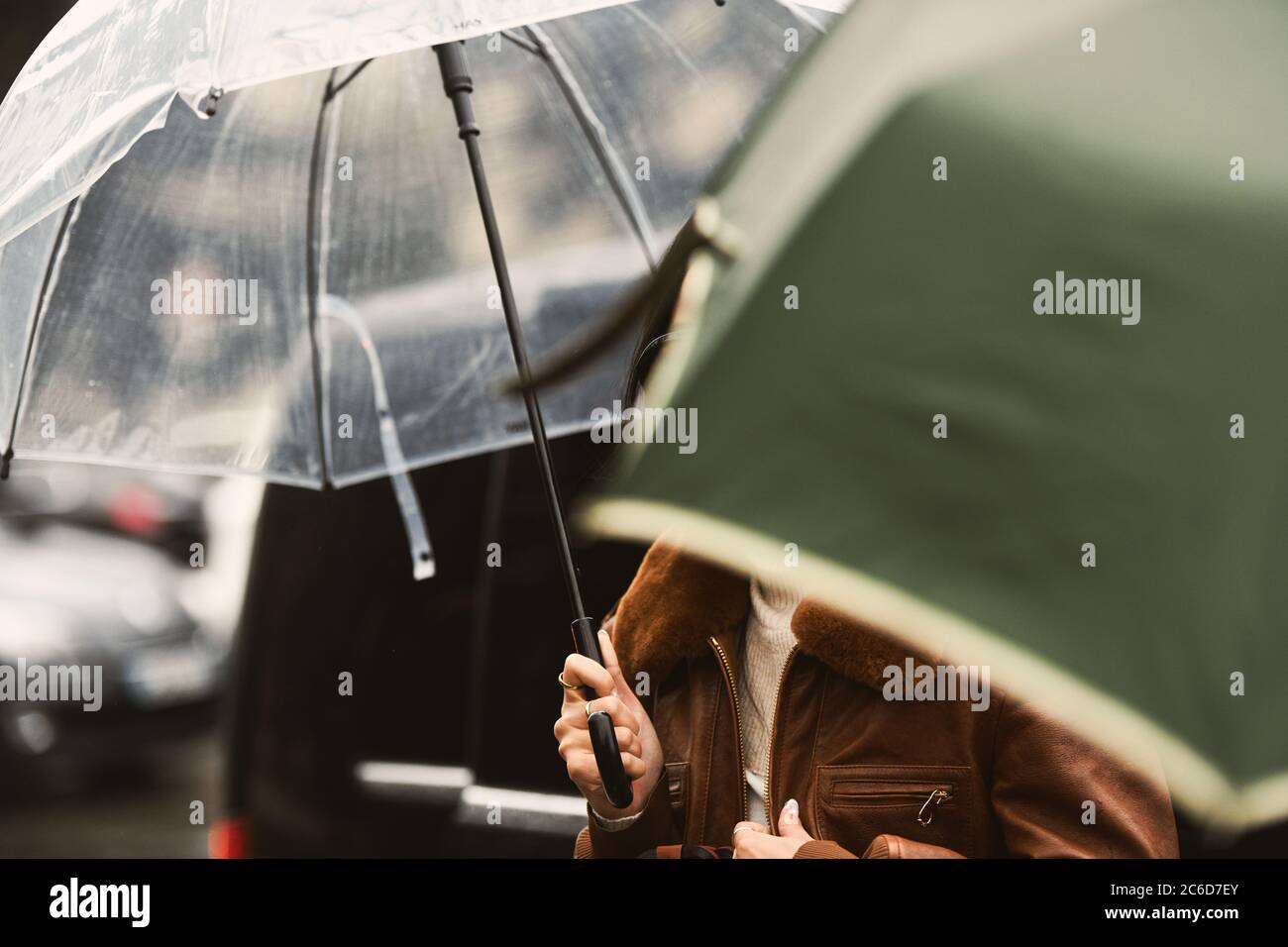 People with an umbrella in a rainy day in Paris Stock Photo - Alamy