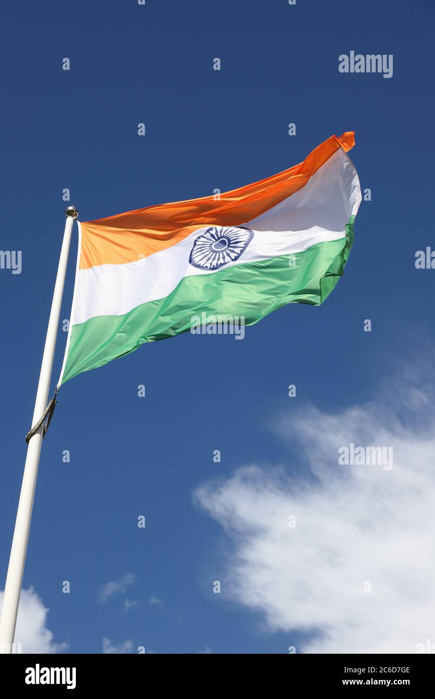 The flag of India against a blue sky.Närbild på indisk flagga mot blå himmel. Stock Photo