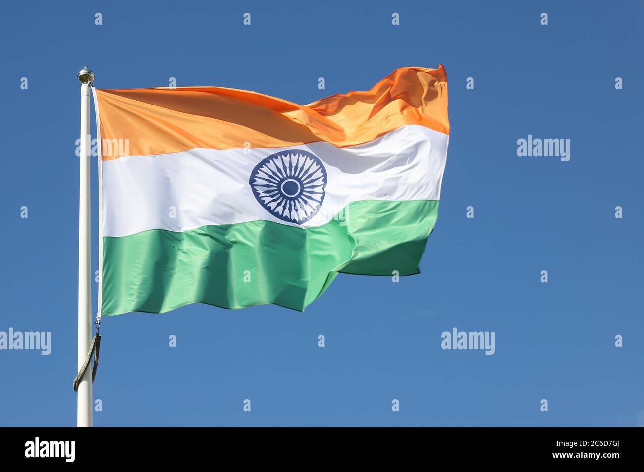 The flag of India against a blue sky.Närbild på indisk flagga mot blå himmel. Stock Photo