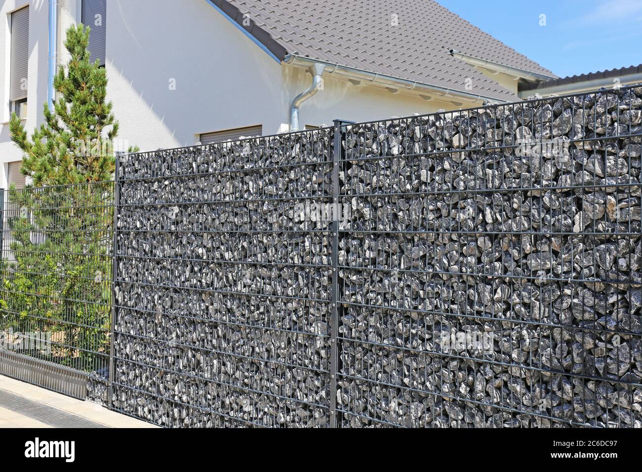 Close up of a gabion as a modern and high-quality visual protection and  property boundary on a residential house Stock Photo - Alamy