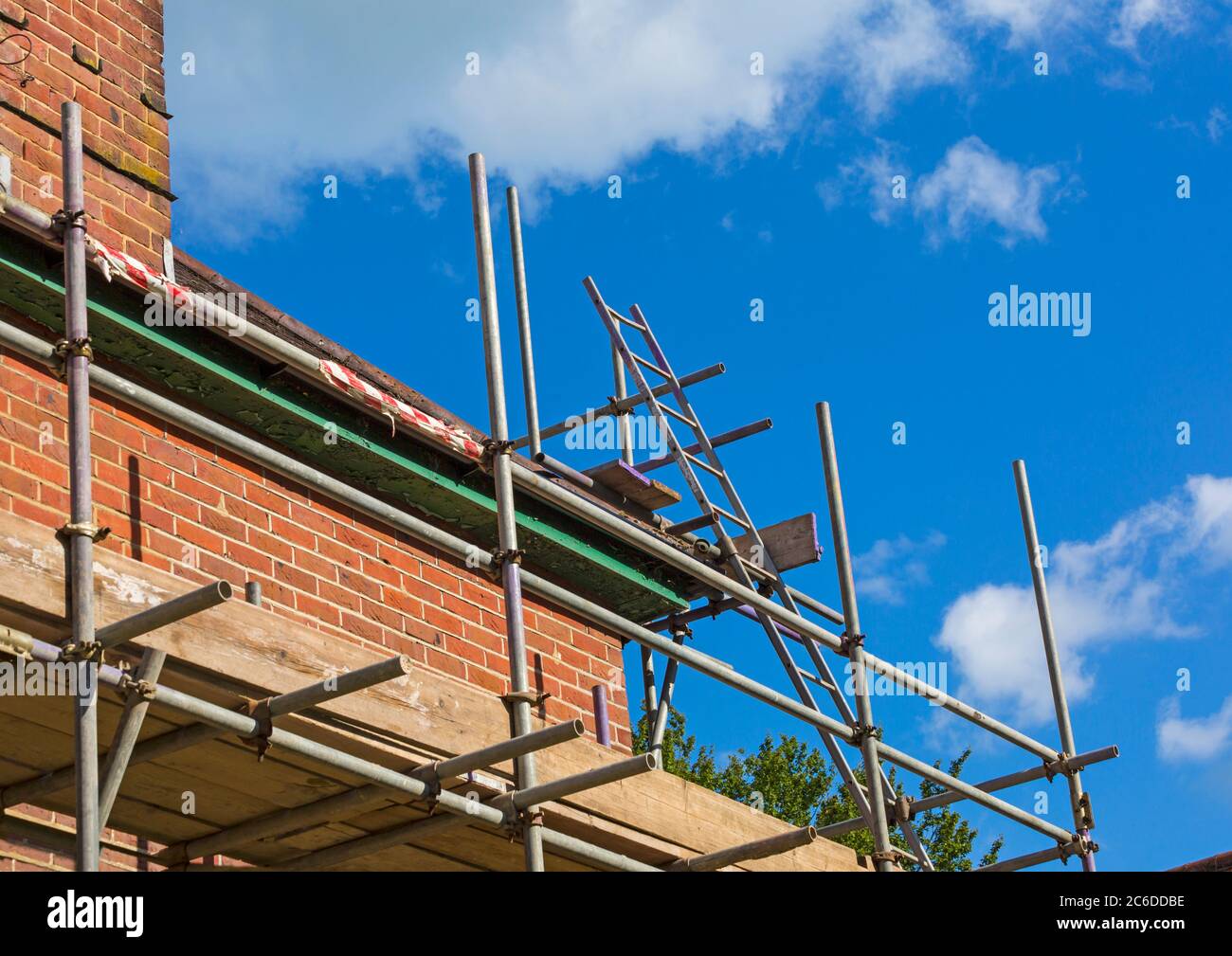 Tubular scaffolding erected around house to carry out repair work at
