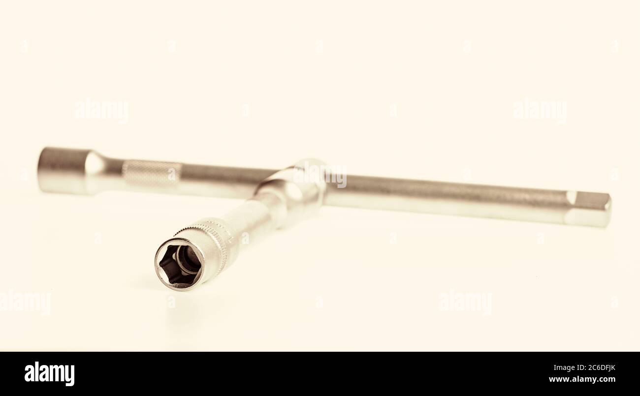 Wheel wrench. Lug wrench is name for type of socket wrench used to