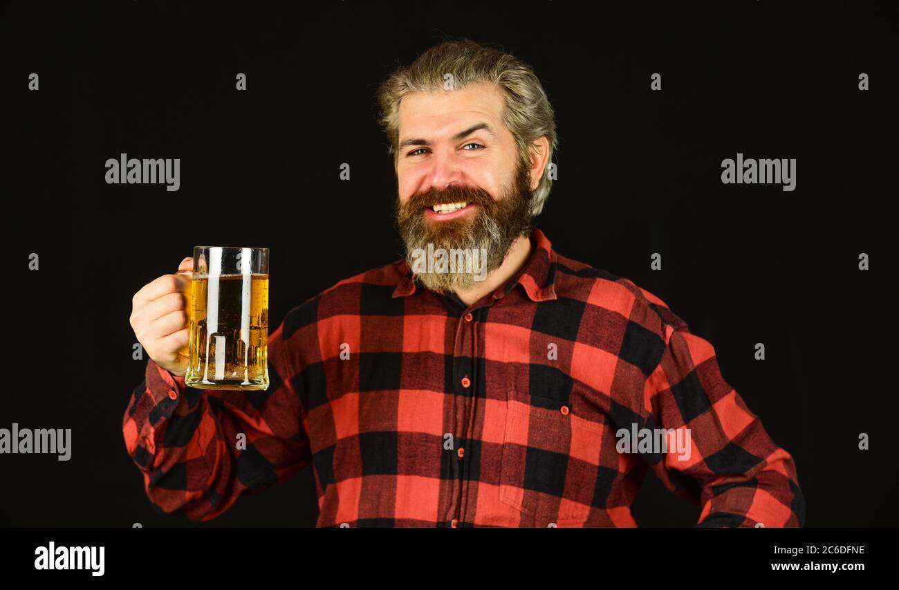 Happy Fathers Day. relaxed handsome man sipping delicious beer. enjoying glass of beer at pub. anticipating fresh cold lager beer. after hard working day. drink draft beer at bar counter in pub. Stock Photo