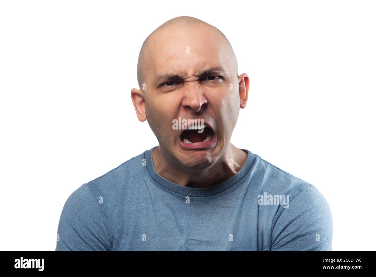 Photo of young bald angry screaming man in blue tee shirt Stock Photo