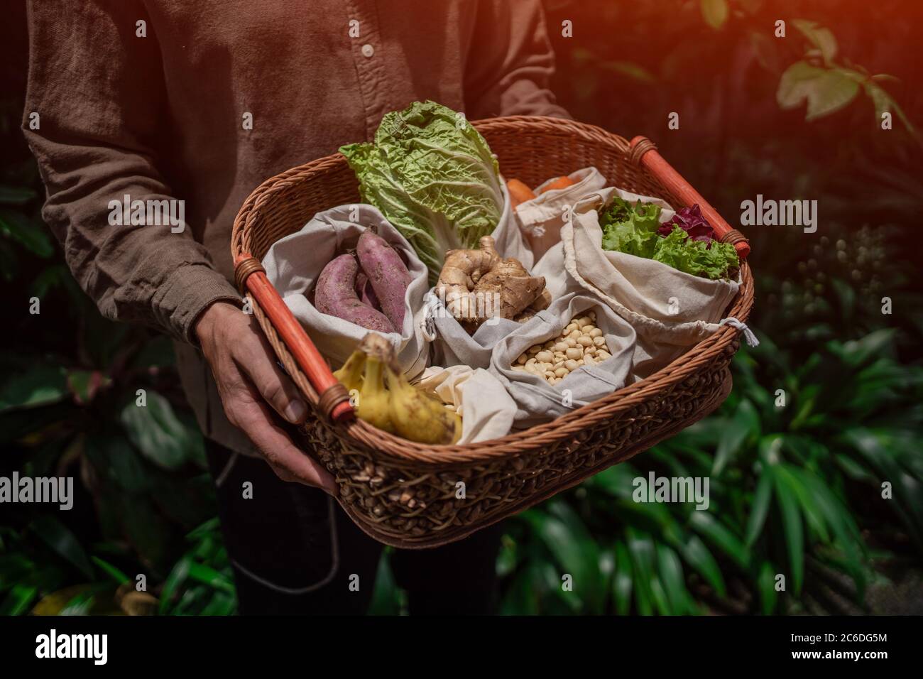 eco friendly and reusable zero waste cotton bags in basket Stock Photo