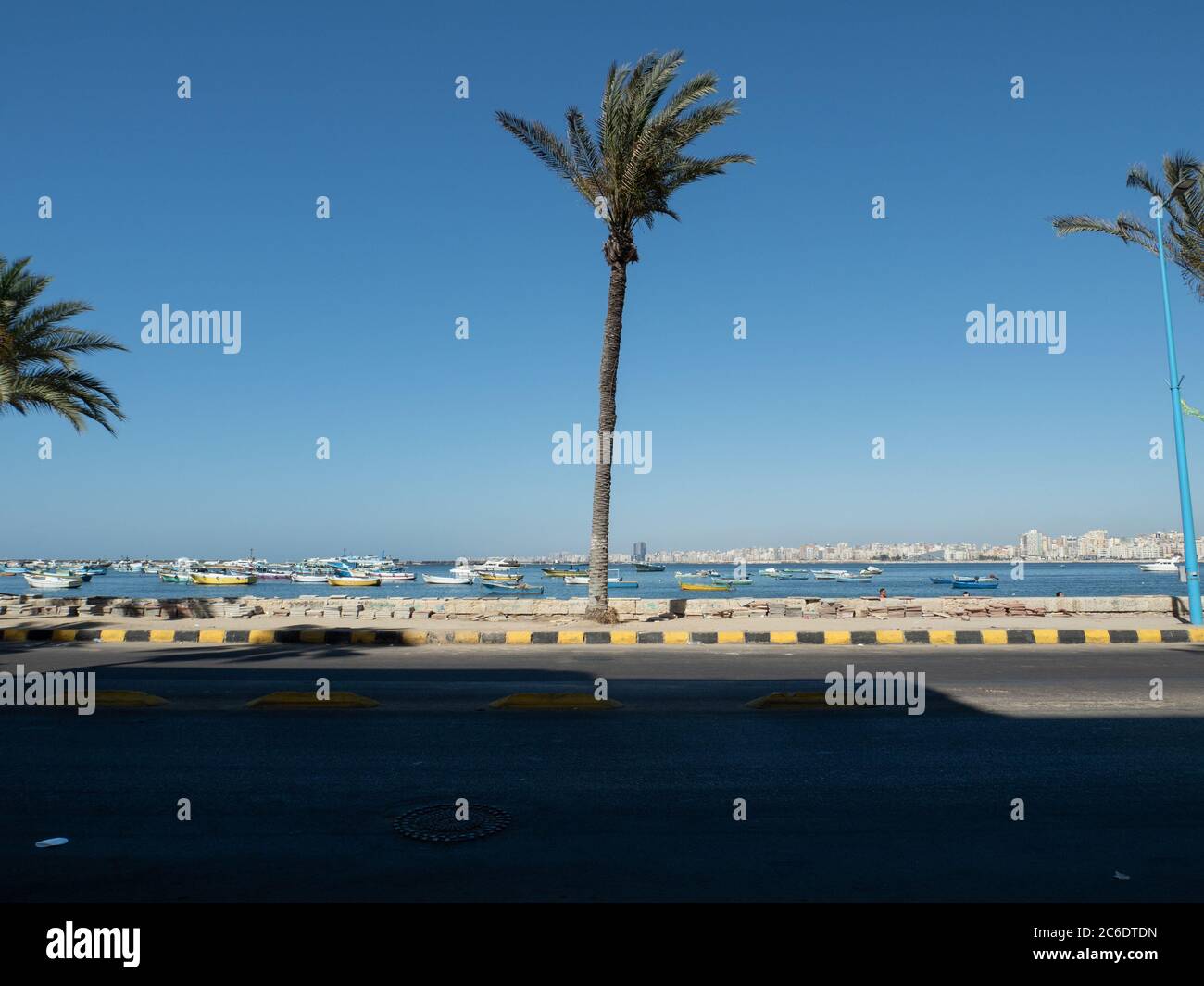 the promenade (corniche) of Alexandria with some boats Stock Photo