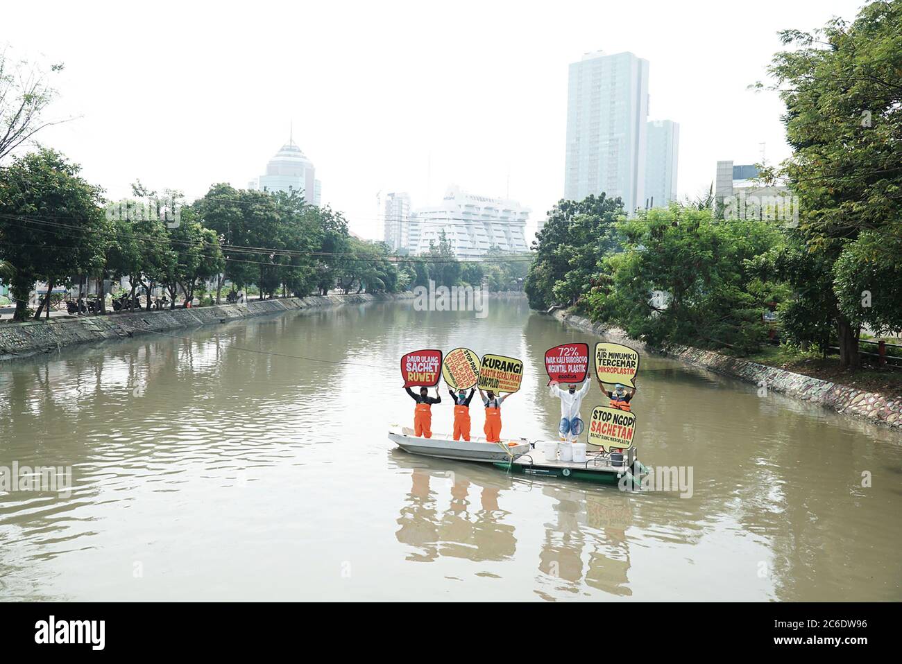 Surabaya Indonesia 09th July 2020 Indonesian Environment Activists From The Ecology And Wetland Conservation Institute Ecoton Seen Holding Placards On A Boat In Kalimas Rivers Surabaya Indonesia During The Protest Against The<script async src=
