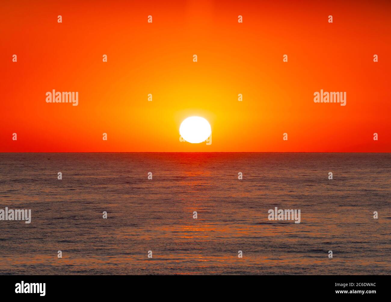 big sun down over sea, red sky Stock Photo - Alamy