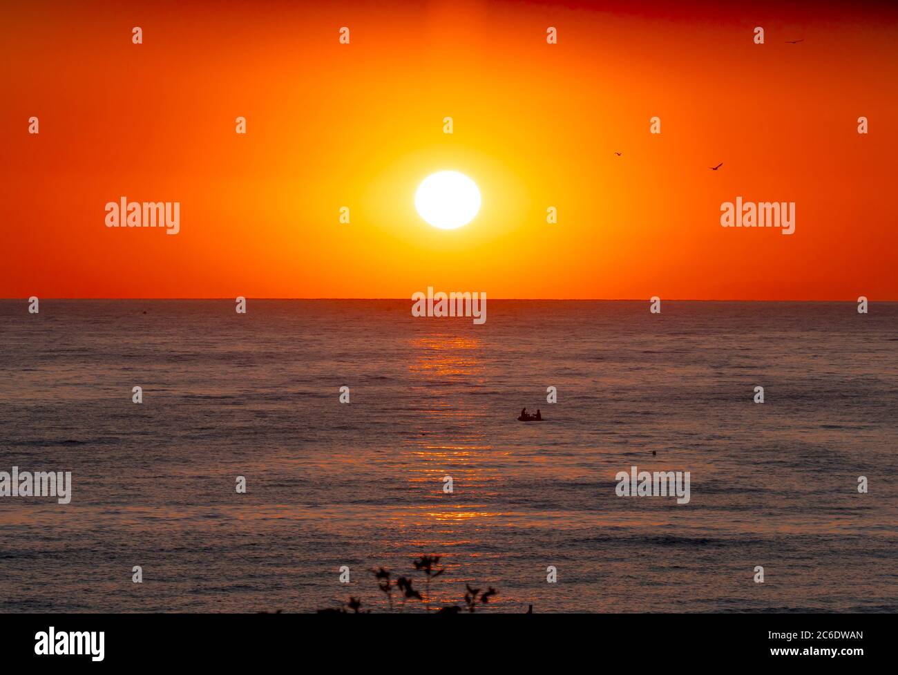 big sun down over sea, red sky Stock Photo - Alamy