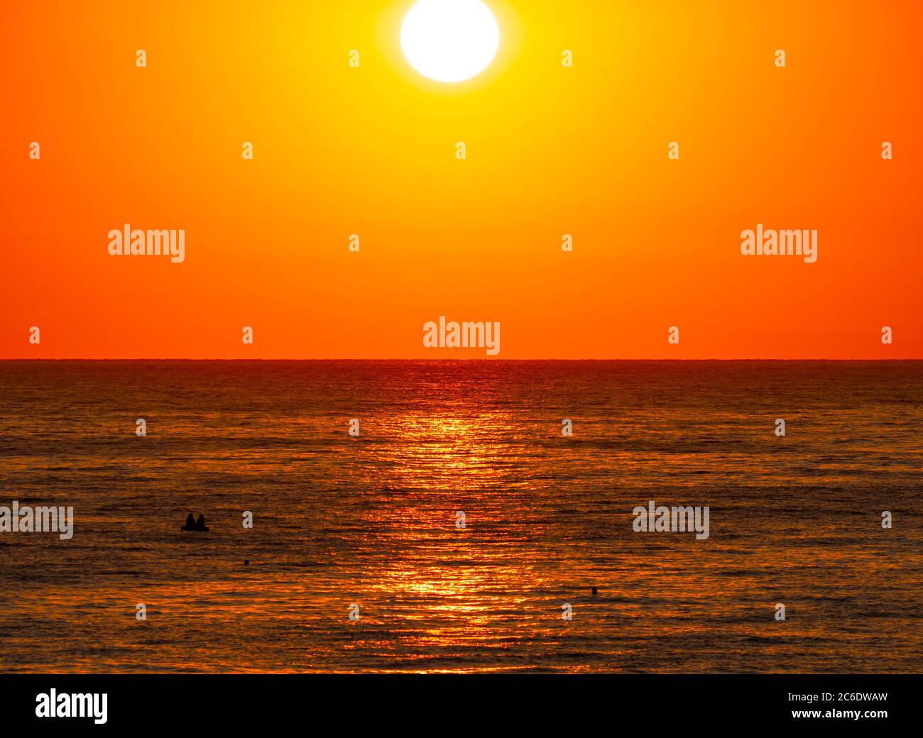 big sun down over sea, red sky Stock Photo - Alamy