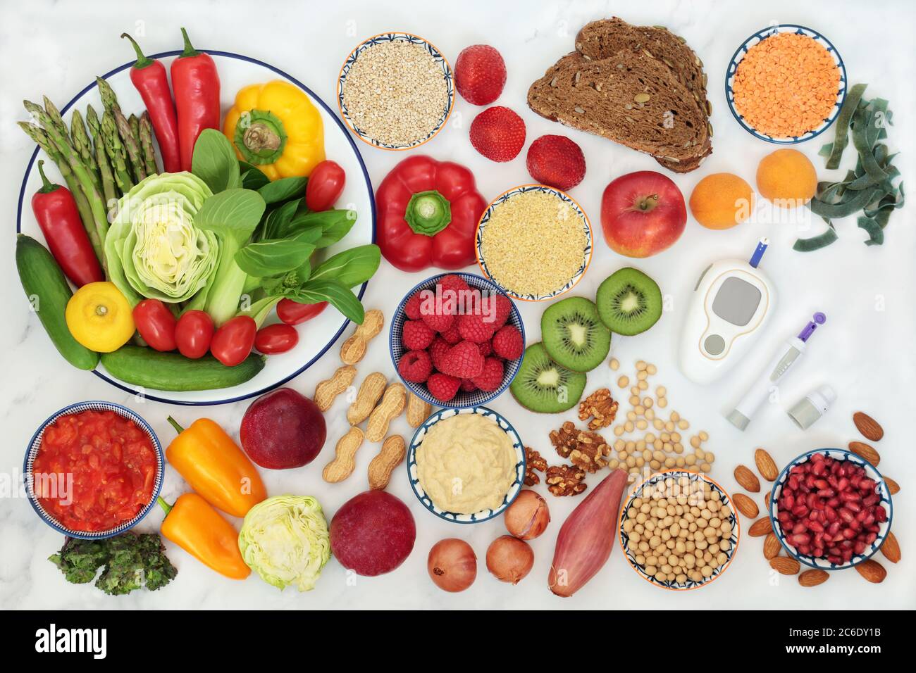 Low glycemic food for diabetics with blood sugar testing device and lance. Health foods below 55 on the GI index. Stock Photo