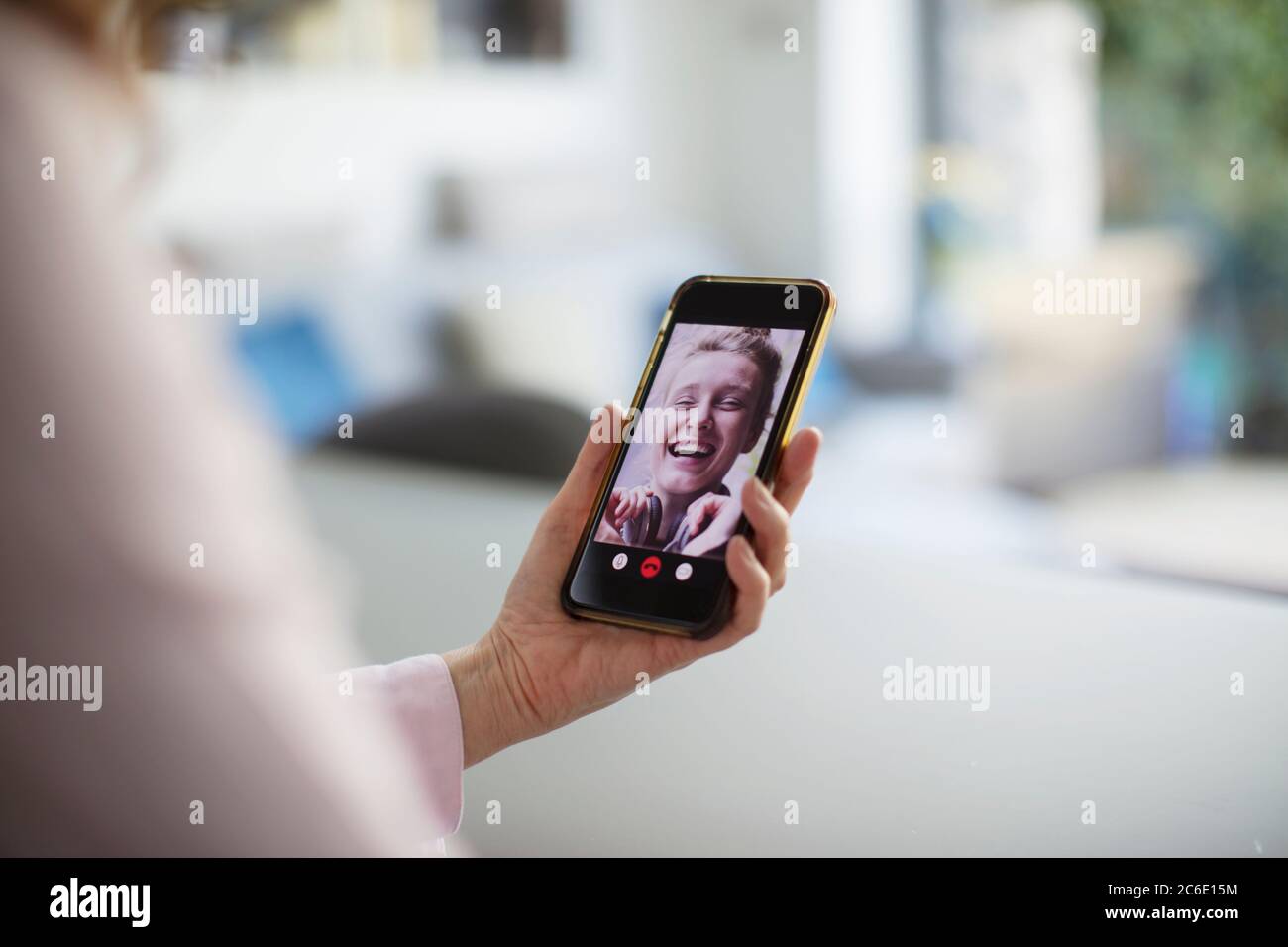 Happy women video chatting with smart phone Stock Photo