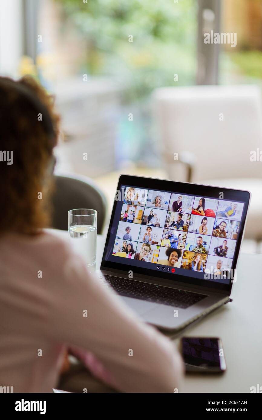 Colleagues video chatting on laptop screen Stock Photo