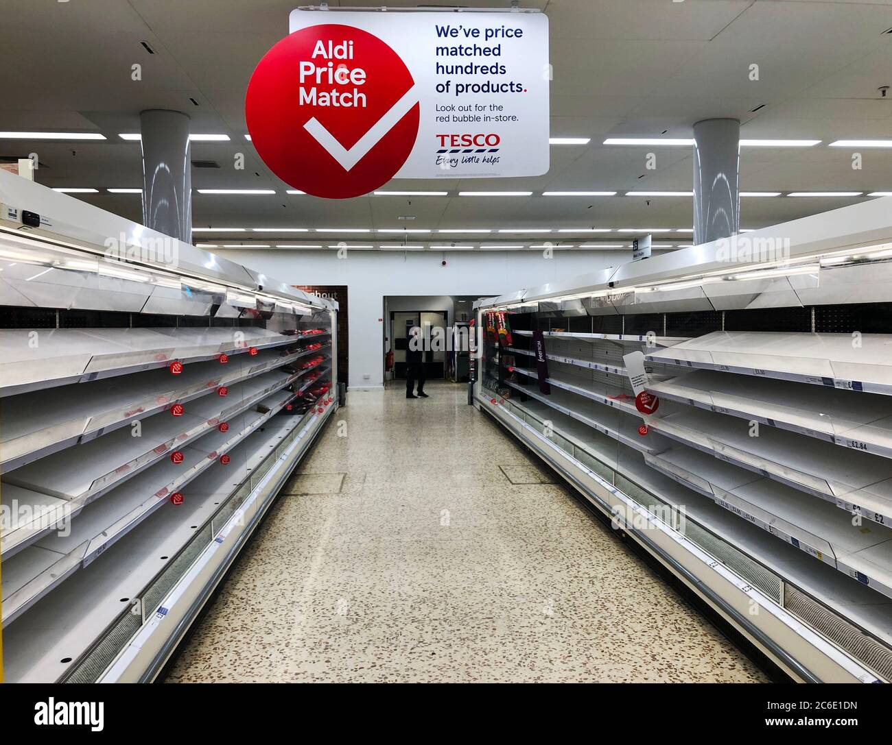 Empty shelves and food aisles in sections of Tesco Aldershot after people stockpile amid Coronavirus on 19 March 2020 in Hampshire, England Stock Photo