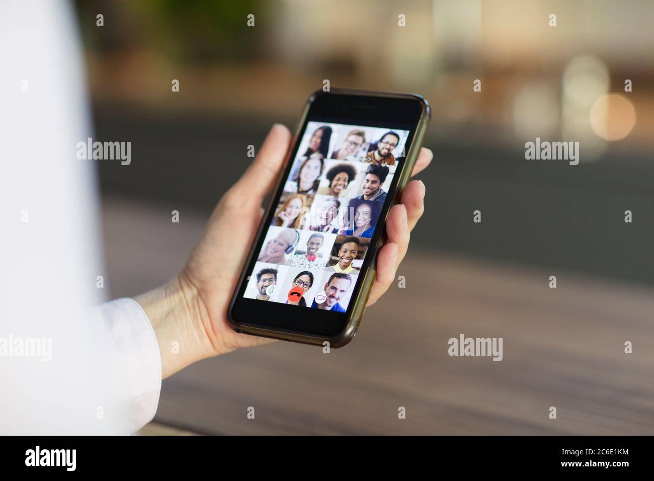 Friends video conferencing on smart phone screen Stock Photo